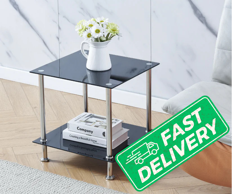 Glass side table with books and a vase on a wooden floor, with a 'Fast Delivery' sign.