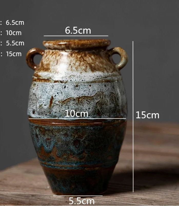 Ceramic vase with dimensions labeled on a wooden surface