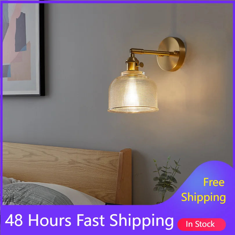 Wall-mounted lamp with gold finish and glass shade in a bedroom setting, with promotional text overlay.