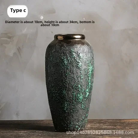 Decorative vase with textured surface on a wooden surface and light gray background